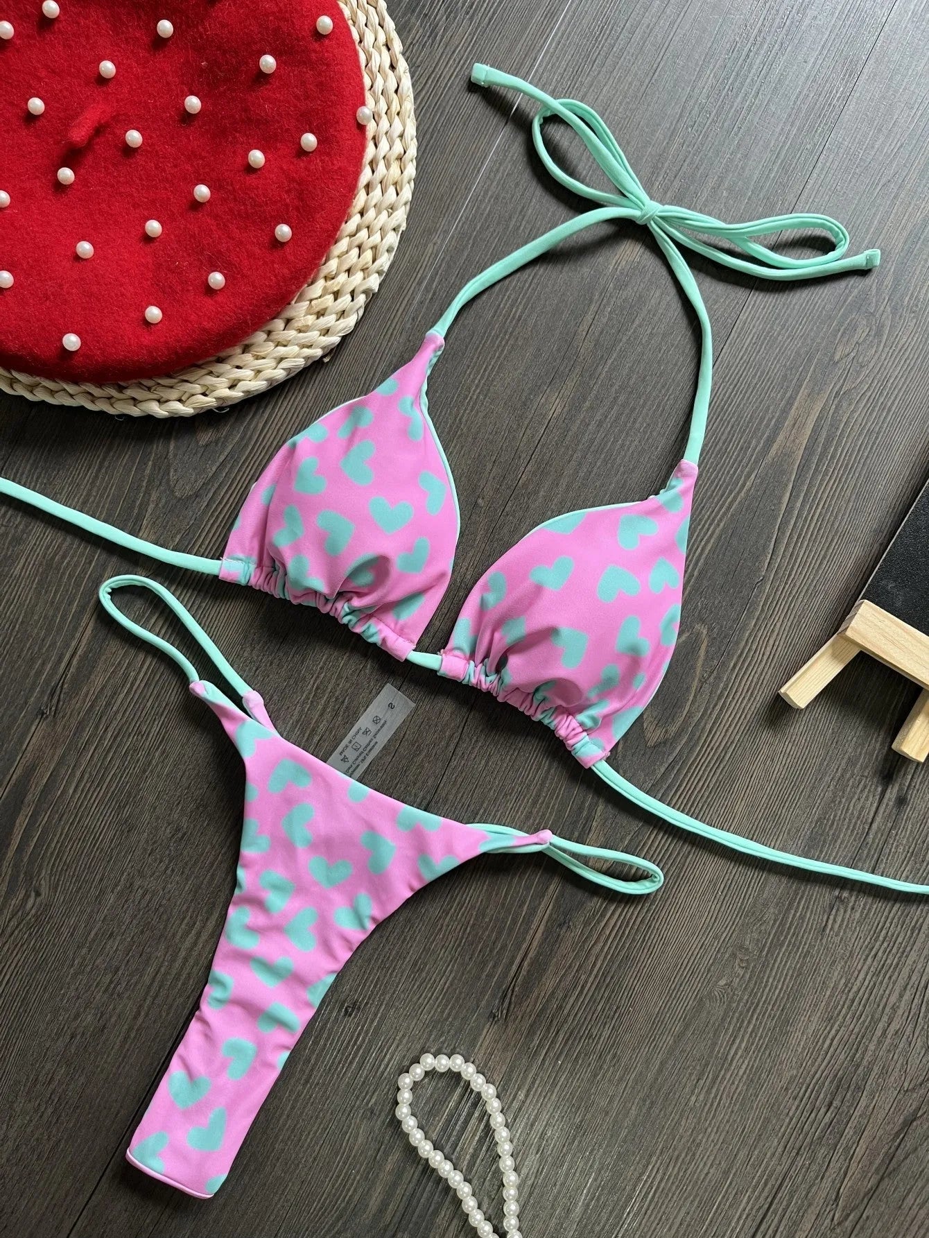 Women's backless split swimsuit with heart printing in nylon and cotton.