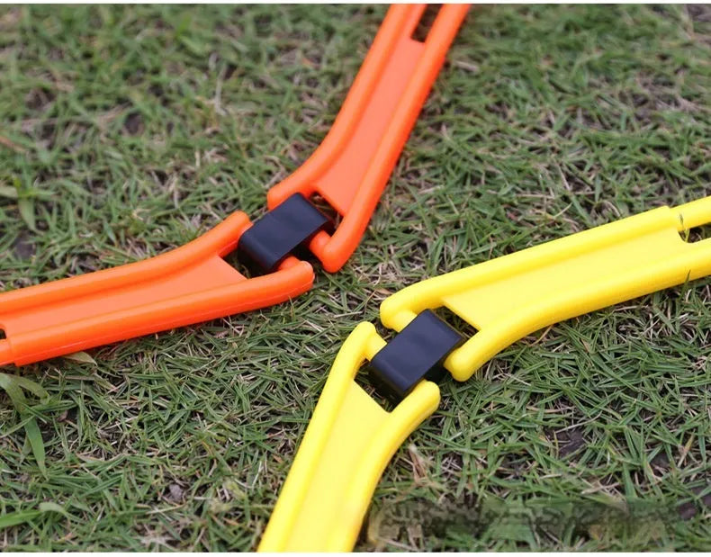Set of six yellow, green, and orange foldable hexagonal football agility training rings laid flat.