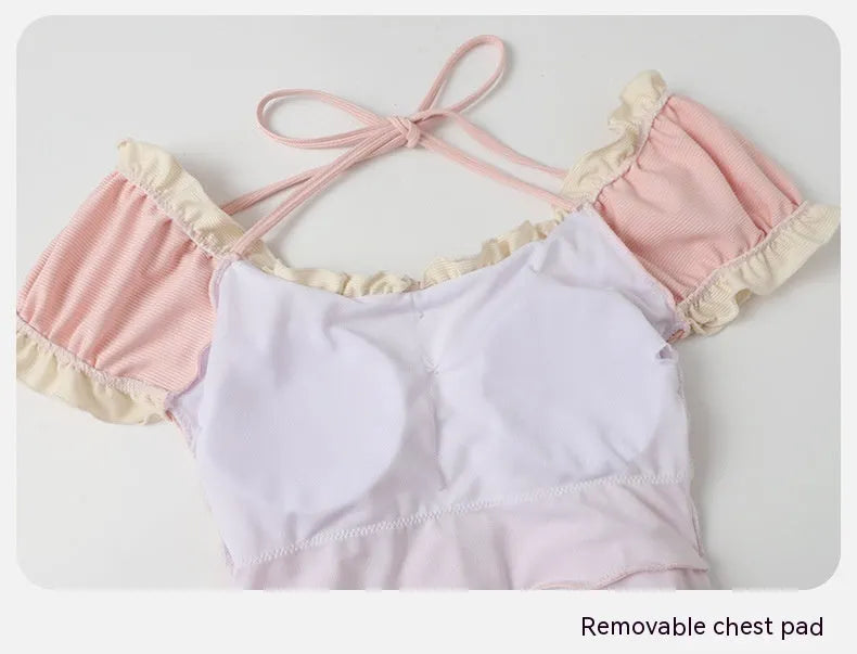 Pink conservative one-piece swimsuit for women in traditional Siamese cut design