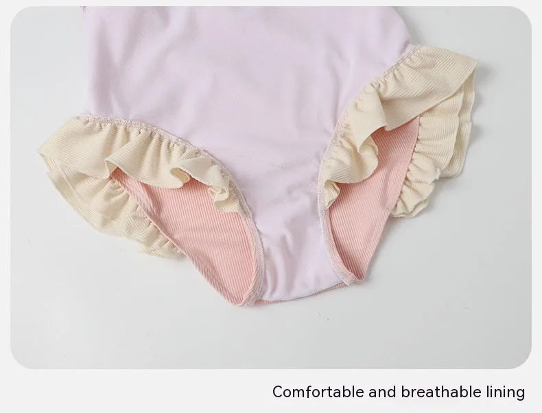 Pink conservative one-piece swimsuit for women in traditional Siamese cut design