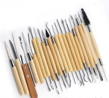 Brown roll package containing 27 pottery clay sculpting tools made of stainless steel, wood, and plastic.