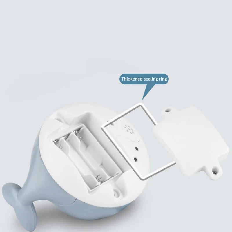 Automatic water-sensing whale spray bath toy with flashing lights for baby bath time