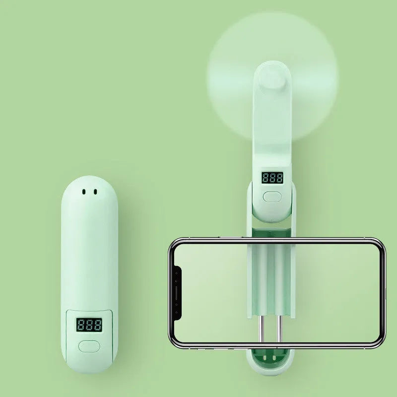 Green folding mini USB fan with plastic blades in open position