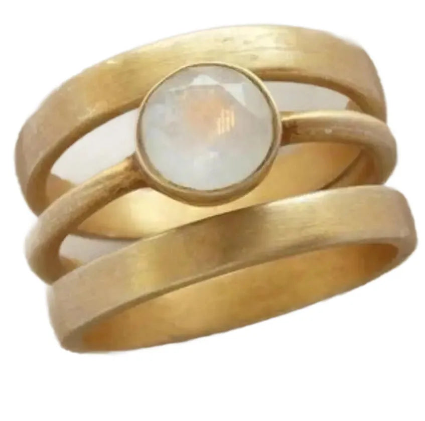 Gold geometric titanium steel ring with white chalcedony stone in a hollow micro-inlaid setting.