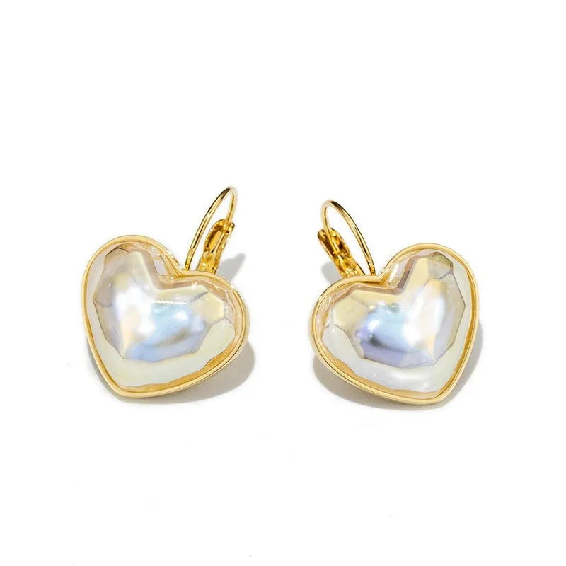A pair of gold-coloured alloy ear clips for women in a natural style.