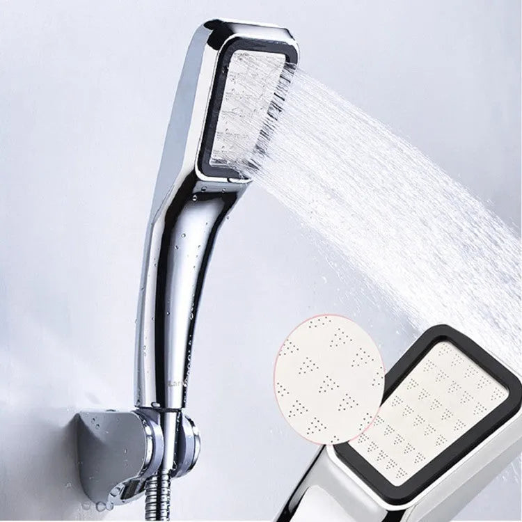 Hand-held pressurised shower with orange shower head and rain function