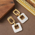 Hollow geometric square earrings in copper with electroplated finish and chamfered corners