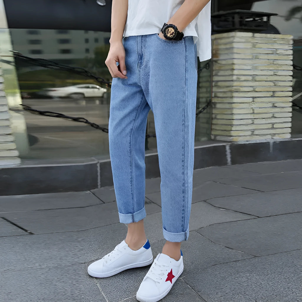Men's straight-leg cotton jeans in black and blue colours showing loose fit design
