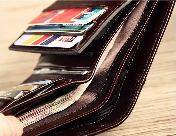 Men's leather wallet showing multiple compartments including card slots and change pocket