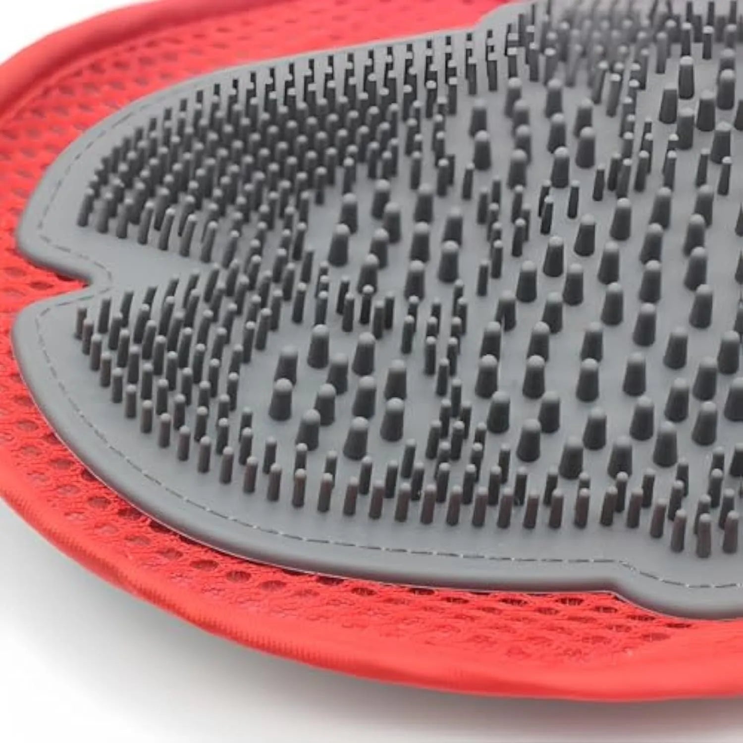 Red pet bathing glove with integrated cleaning brush surface for grooming and washing dogs or cats.