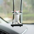 Cartoon-style resin cat pendant on a 25cm rope for hanging from a car rear-view mirror.