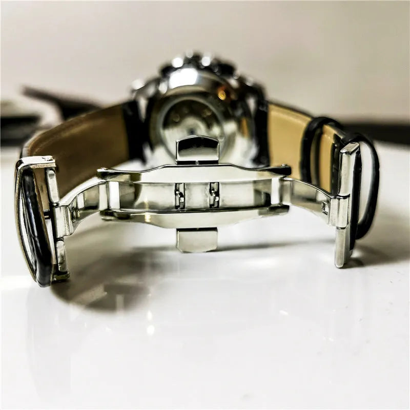 Men's automatic mechanical watch with silver case and white dial showing 12mm thickness