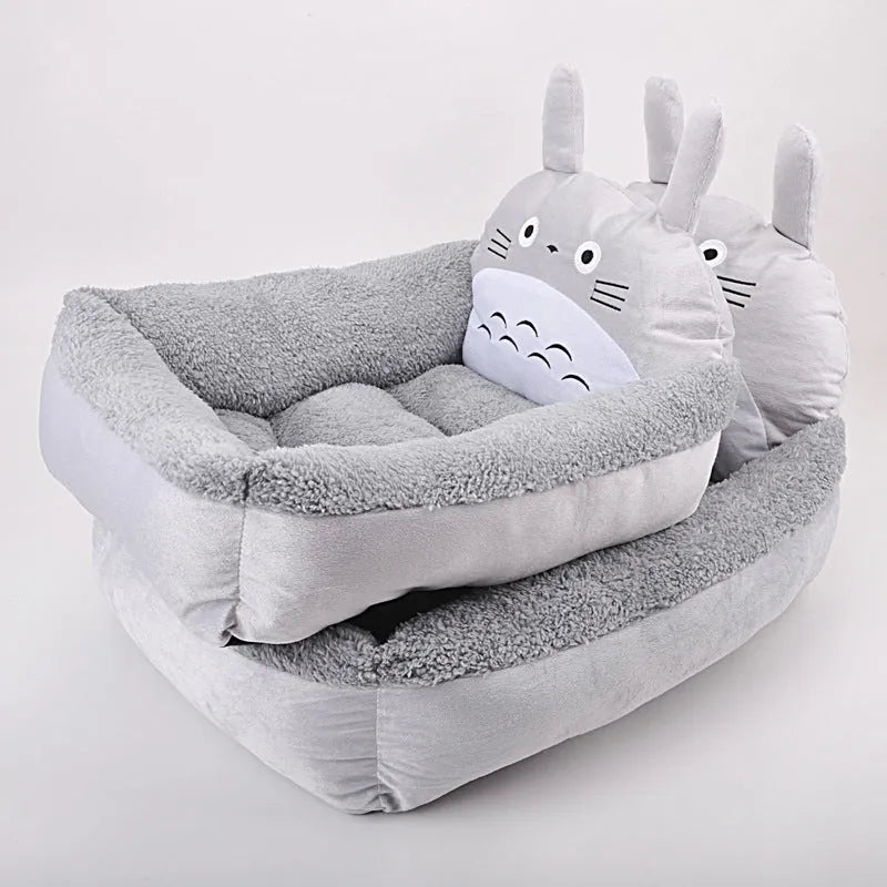Cartoon-style plush pet sofa bed for small dogs and cats with a washable cover.