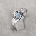 Geometric ellipse women's ring with inlaid zircon stones in Q941 white gold finish on copper