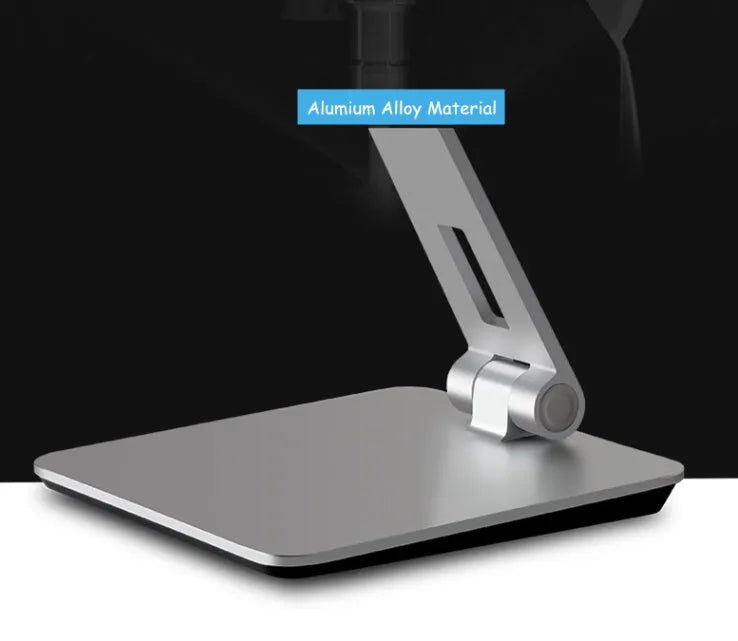 Silver folding aluminium phone and tablet stand with 360° rotation on wooden desk