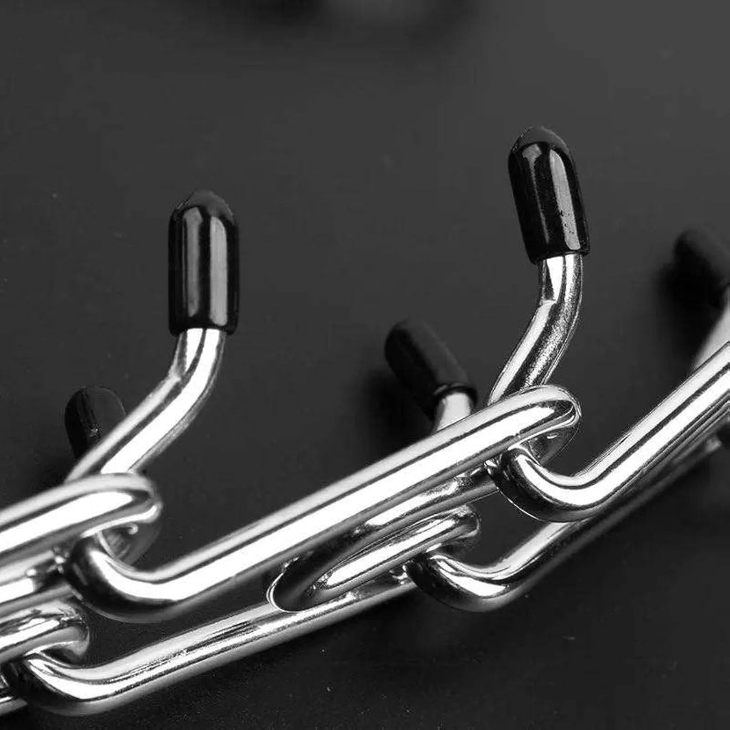 Stainless steel dog prong training collar with rubber tips on adjustable metal links.
