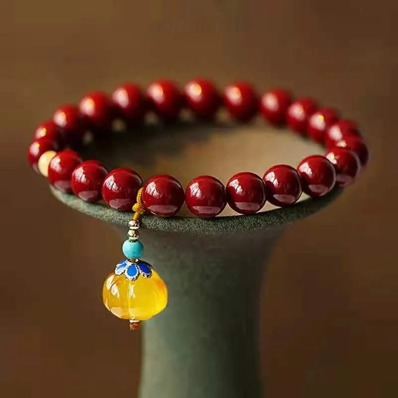 Handmade cinnabar bracelet with copper bead accent in wave shape, unisex design, available in pumpkin or brand cinnabar