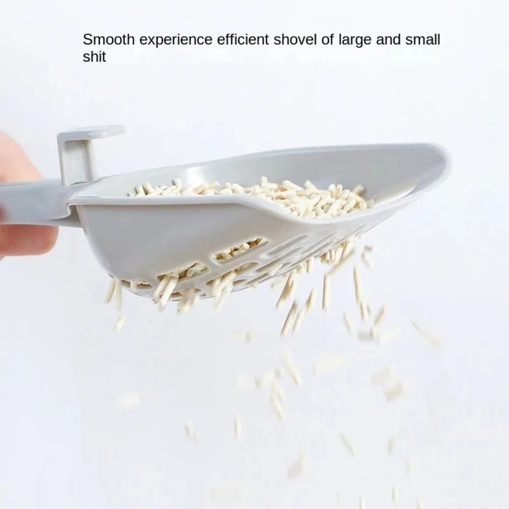 Grey plastic cat litter scoop sitting in its matching plastic storage base.