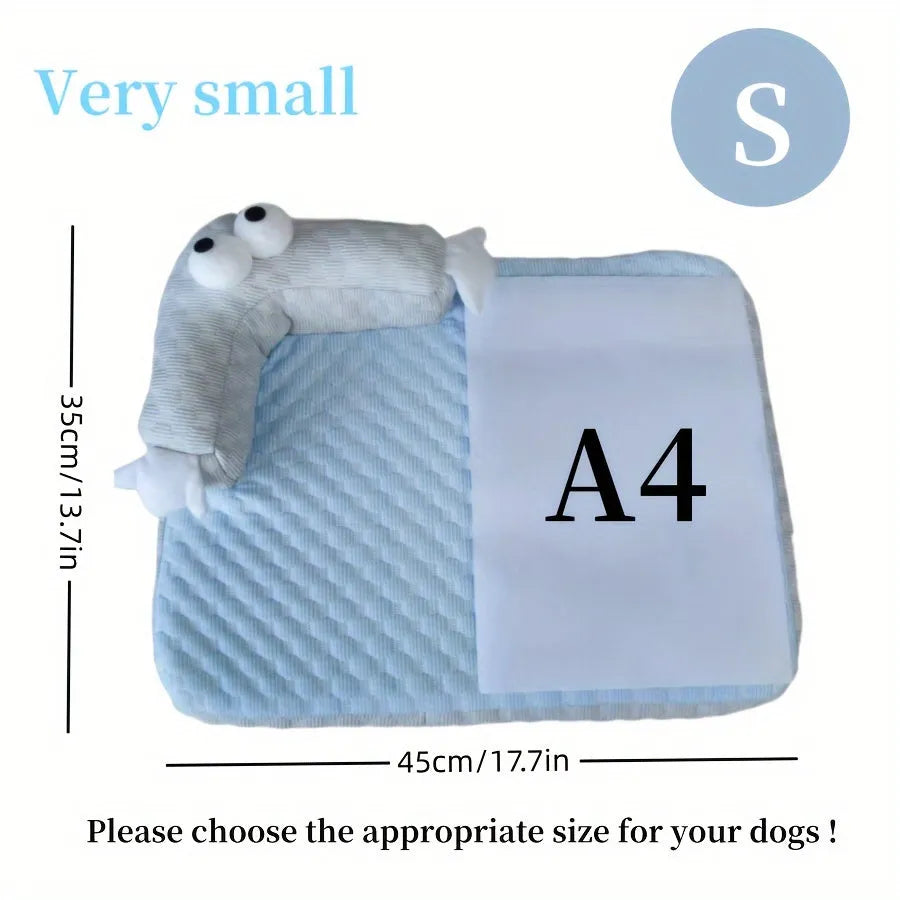 Blue big-eyed monster design breathable pet cooling bed for dogs and cats on a wooden floor.