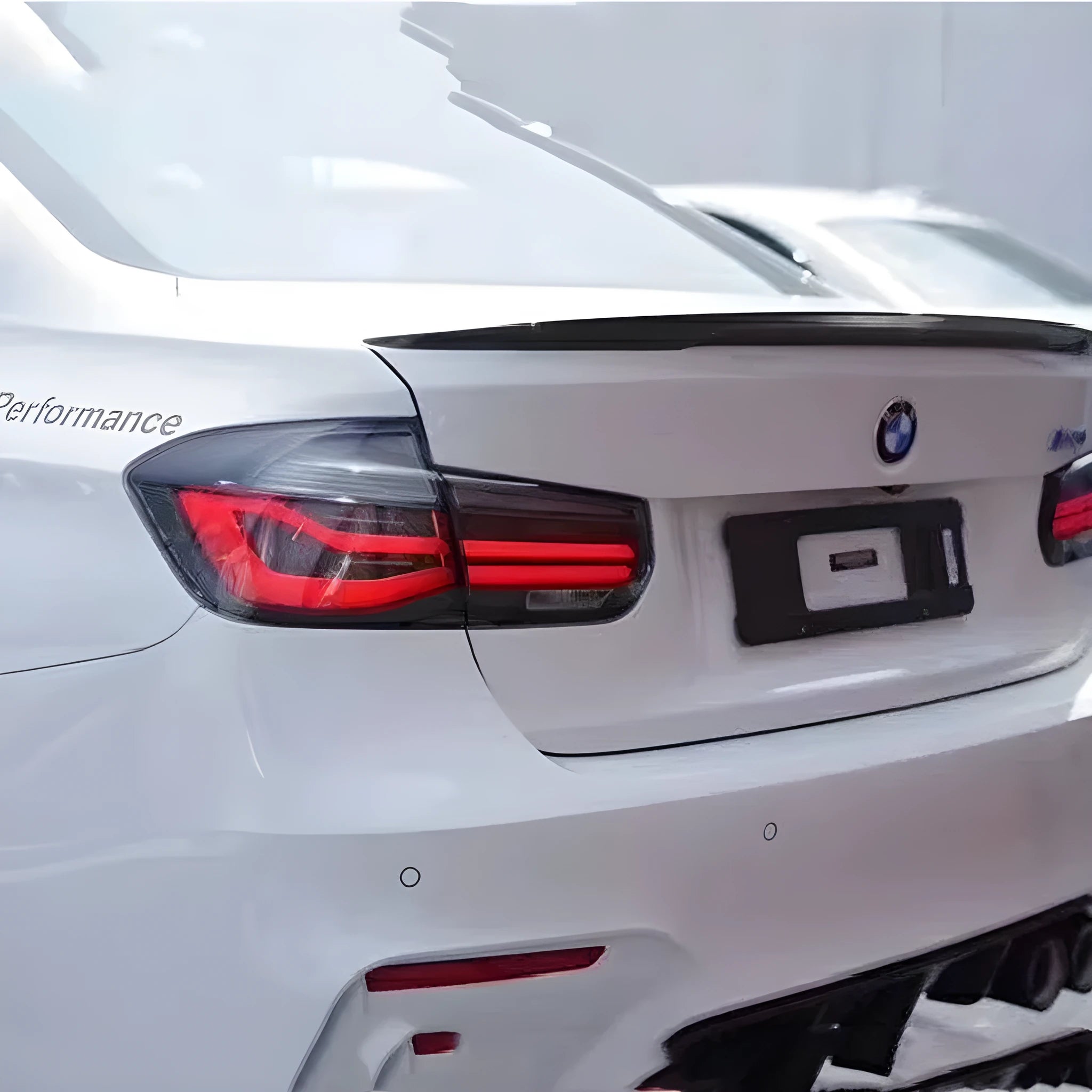 BMW 3 Series aftermarket LED tail light assembly in red or smoked black for 12-15 model years.