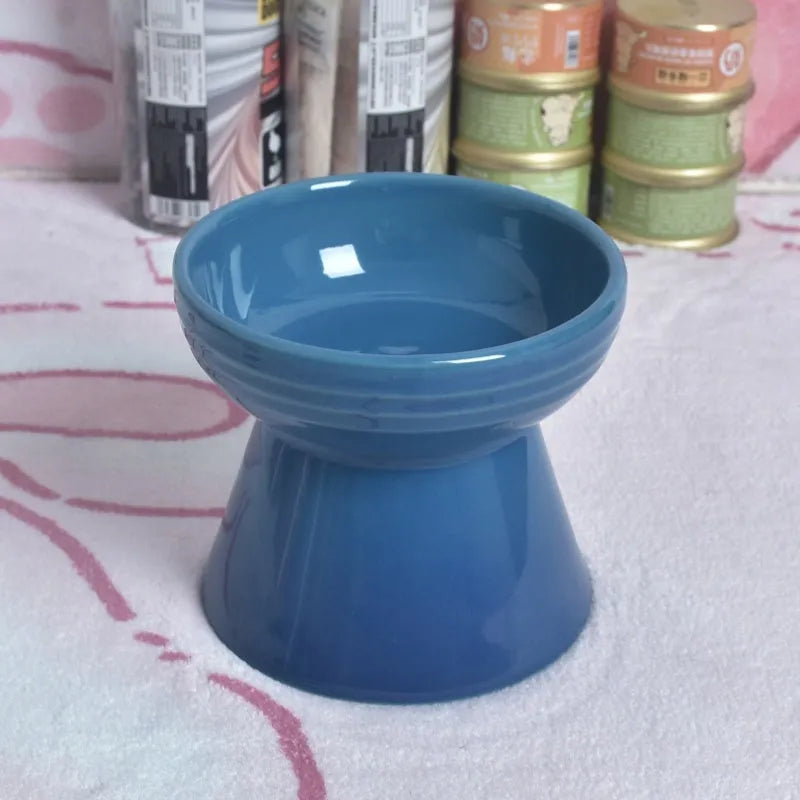 Ceramic anti-tumble pet bowl for dogs and cats with high foot and neck protector.
