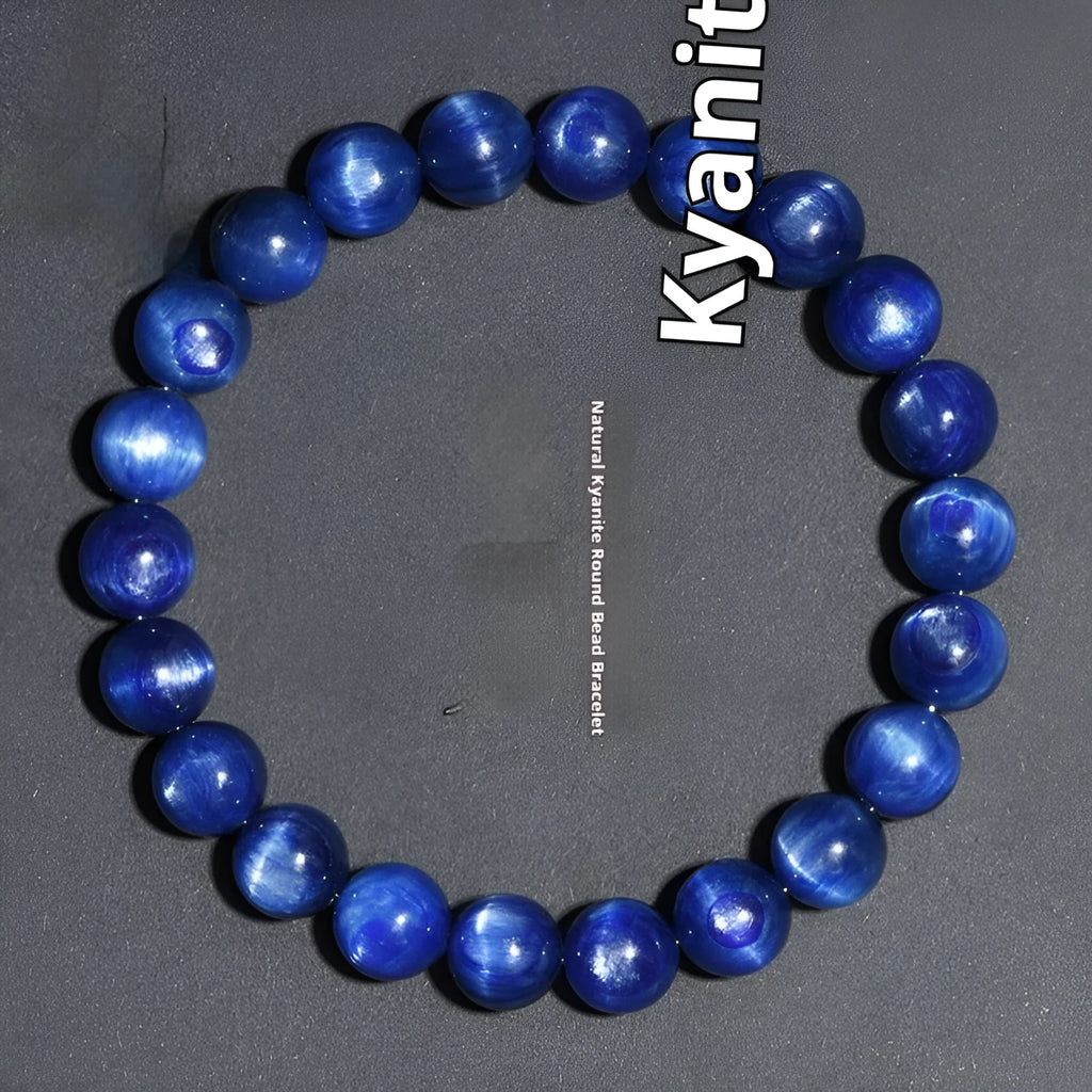 Polished blue crystal bracelet with geometric shapes and ruyi design elements on wrist