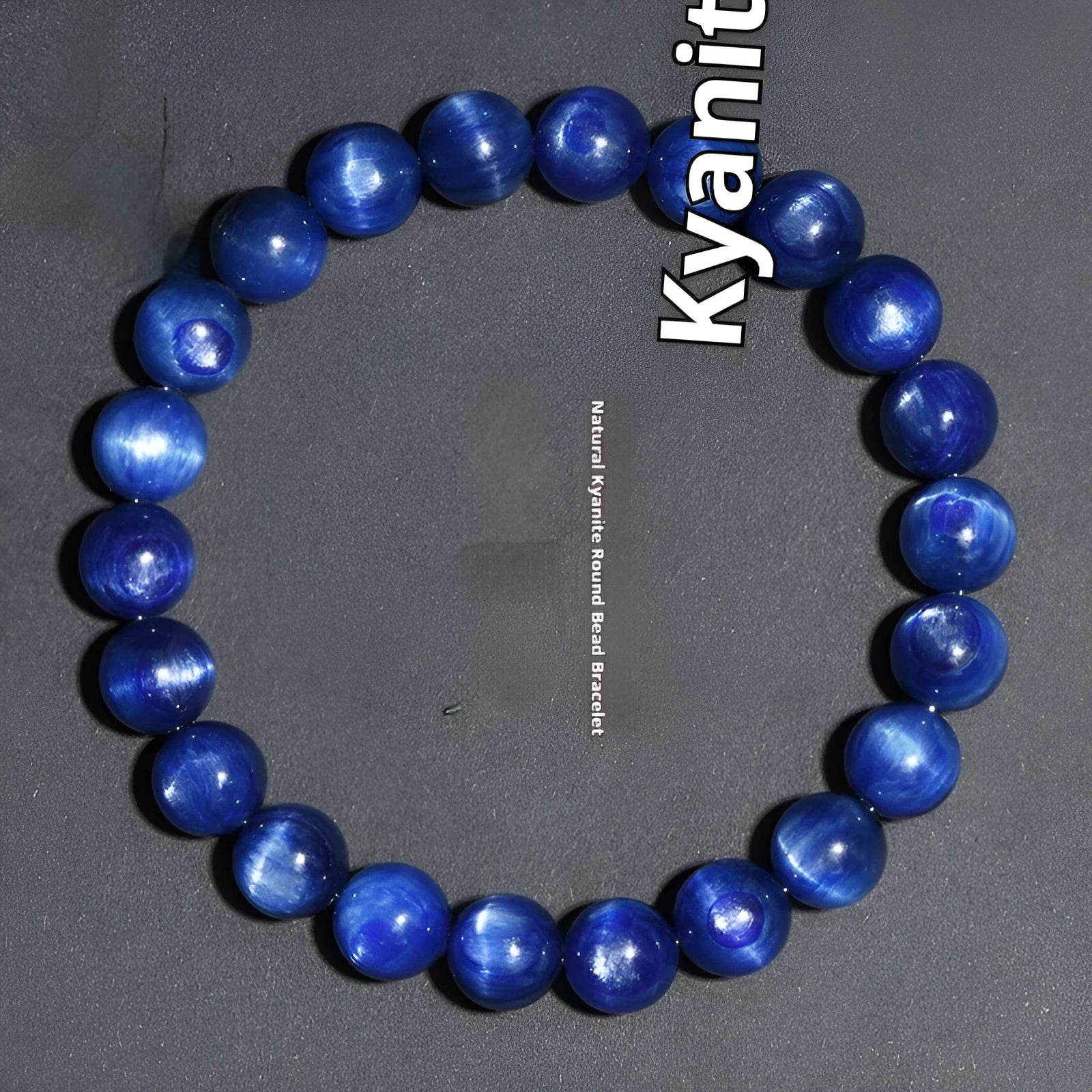 Polished blue crystal bracelet with geometric shapes and ruyi design elements on wrist