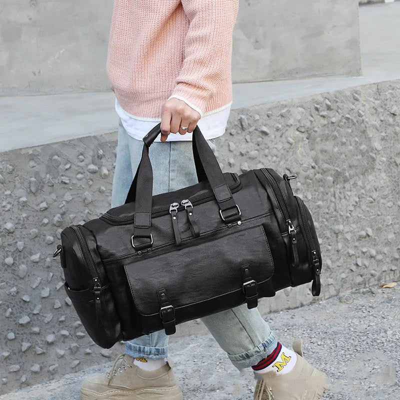 Black PU fabric travel bag with shoe storage compartments showing interior organisation