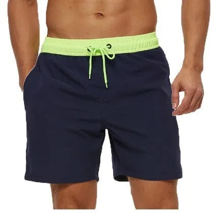 Men's blue running shorts with a drawstring waist and a zippered side pocket.