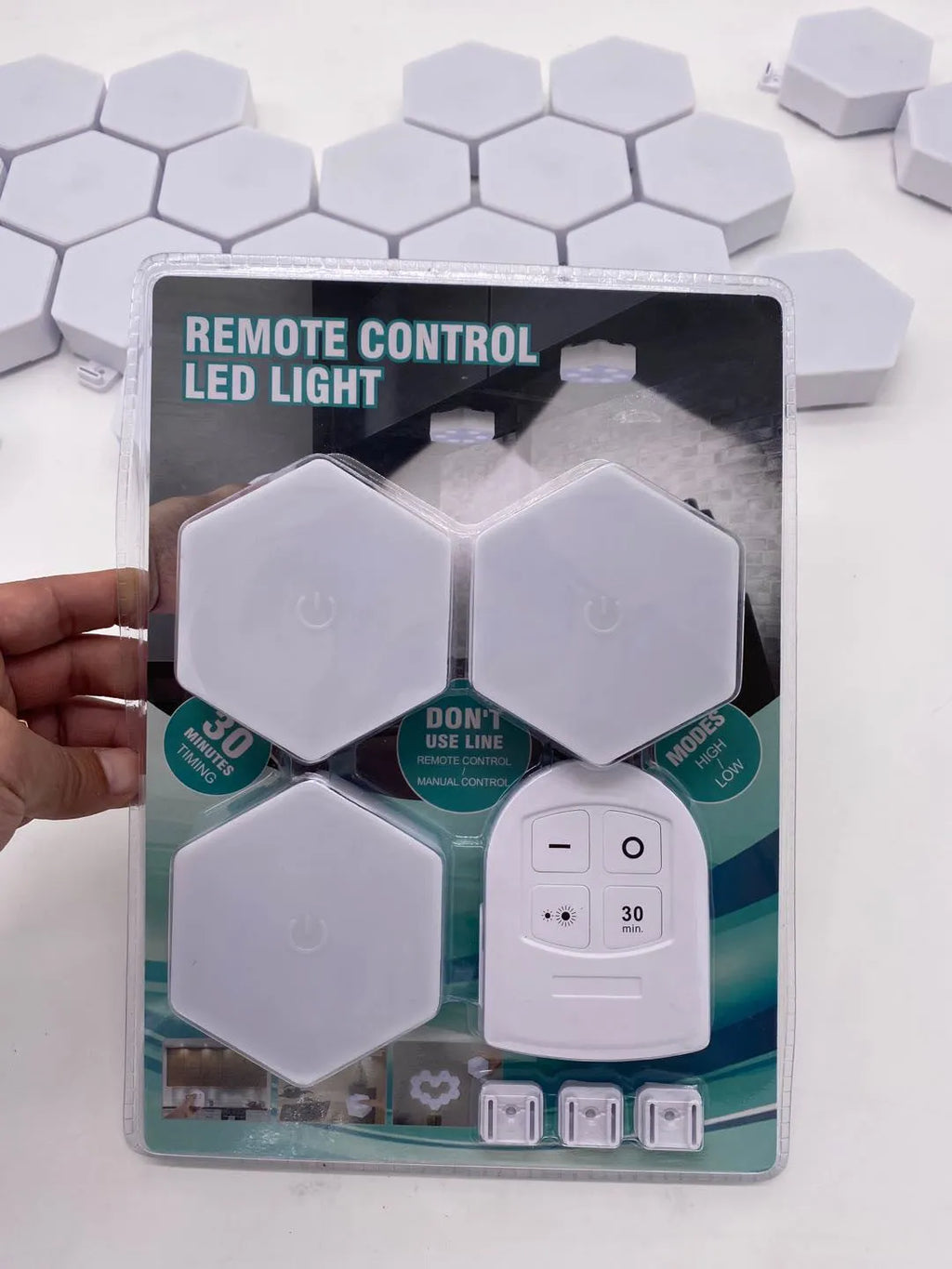 White wireless remote control pat light with ABS shell and 6 LED patches on a shelf