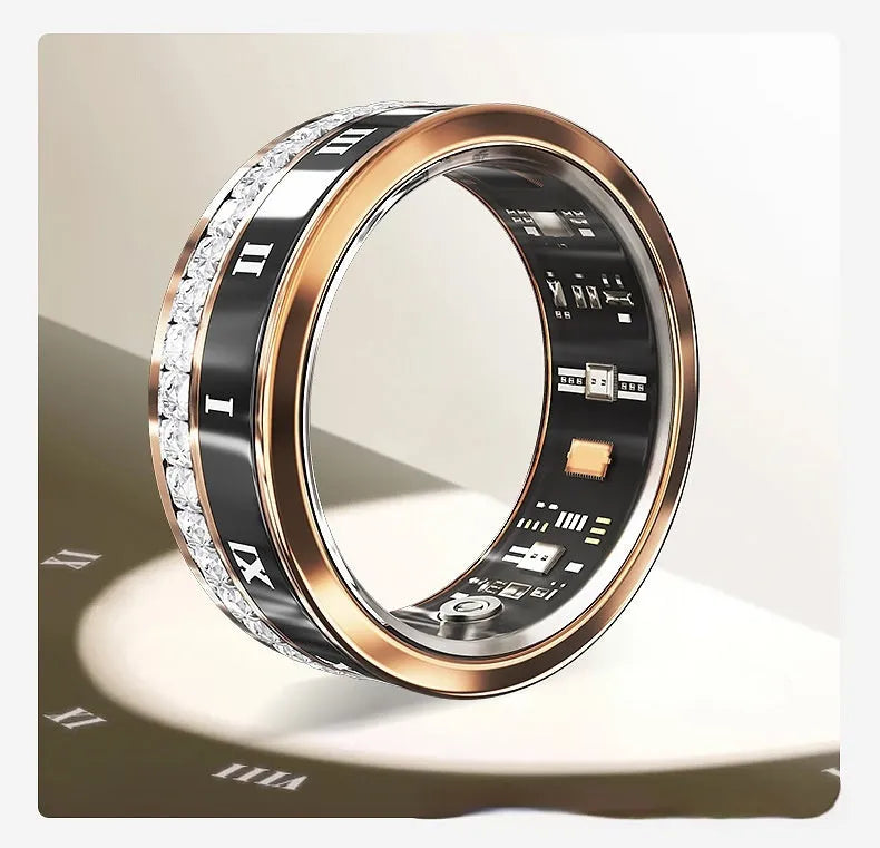 Gold and silver smart ring with diamond inlay on a finger, showing charging cable and box