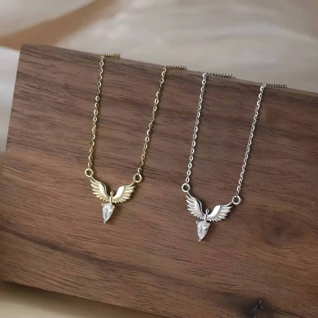 Close-up of a women's sterling silver necklace with an eagle pendant on an O-ring chain.