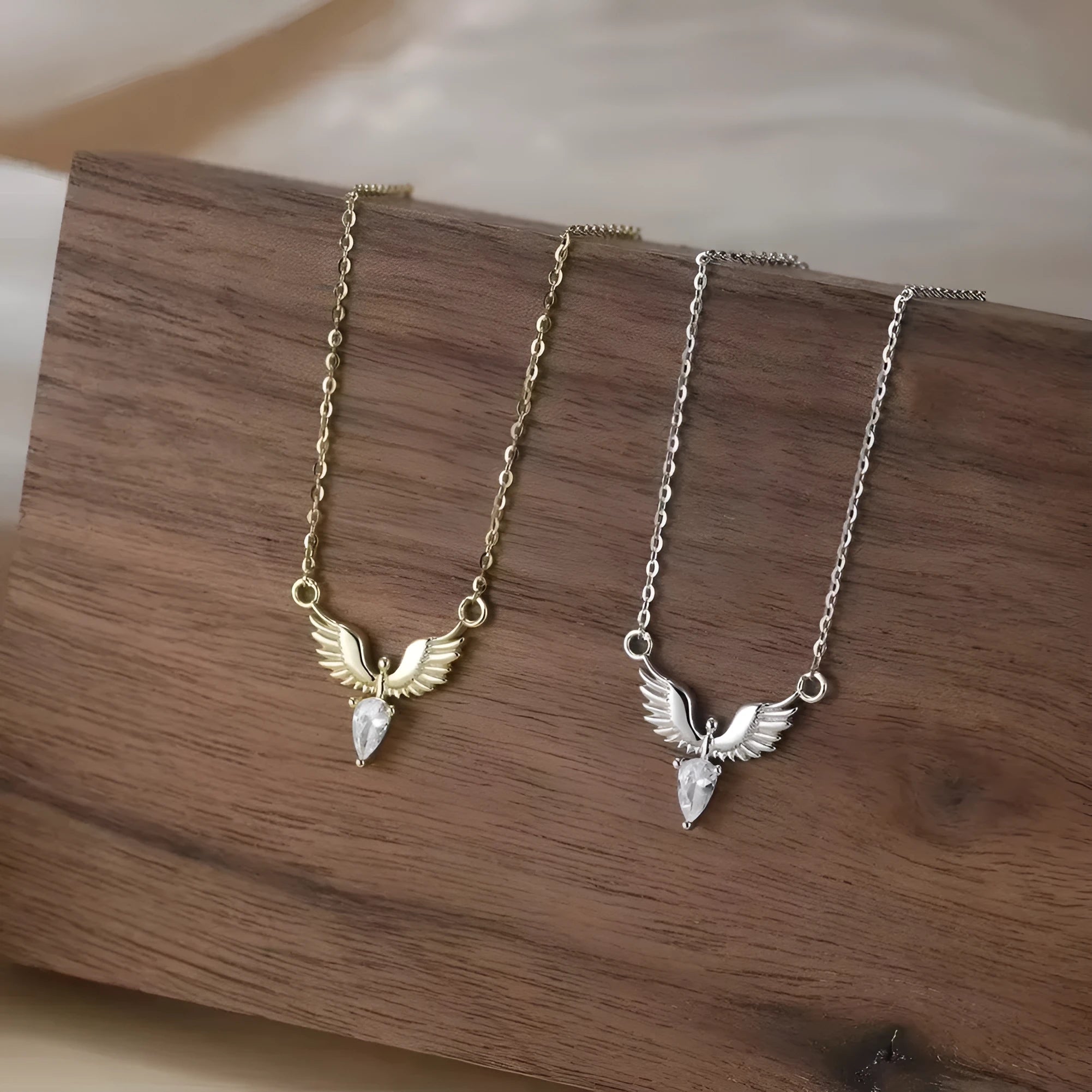 Close-up of a women's sterling silver necklace with an eagle pendant on an O-ring chain.