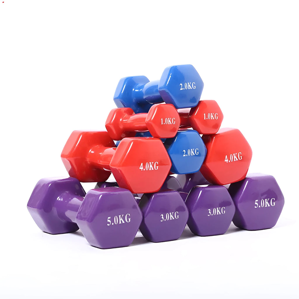 Bright colourful plastic dumbbell for fitness with glossy surface on wooden floor