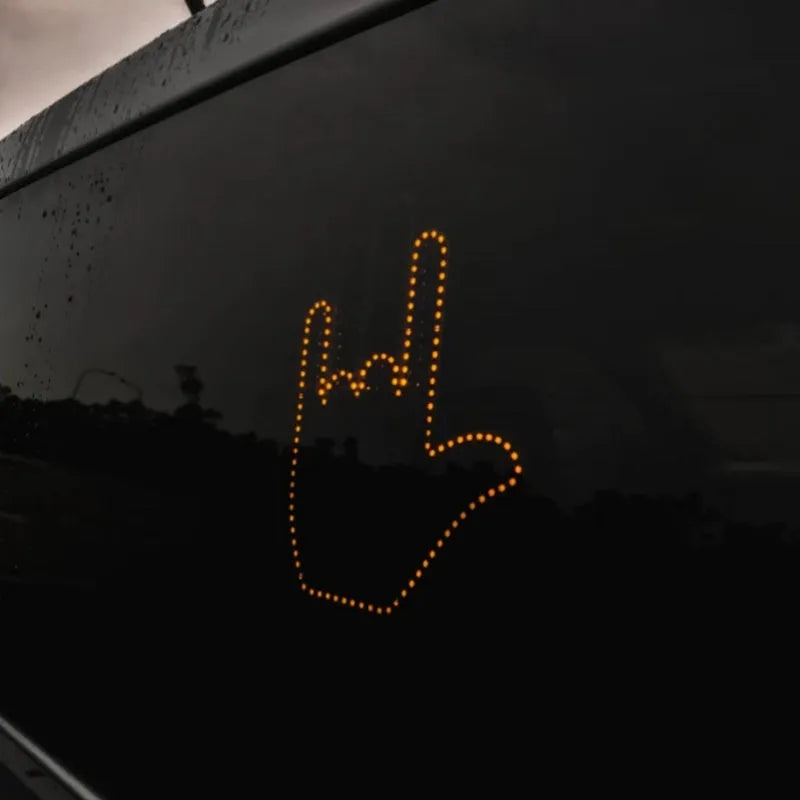 Black plastic gesture light with 176 LED beads showing a middle finger gesture, with remote control