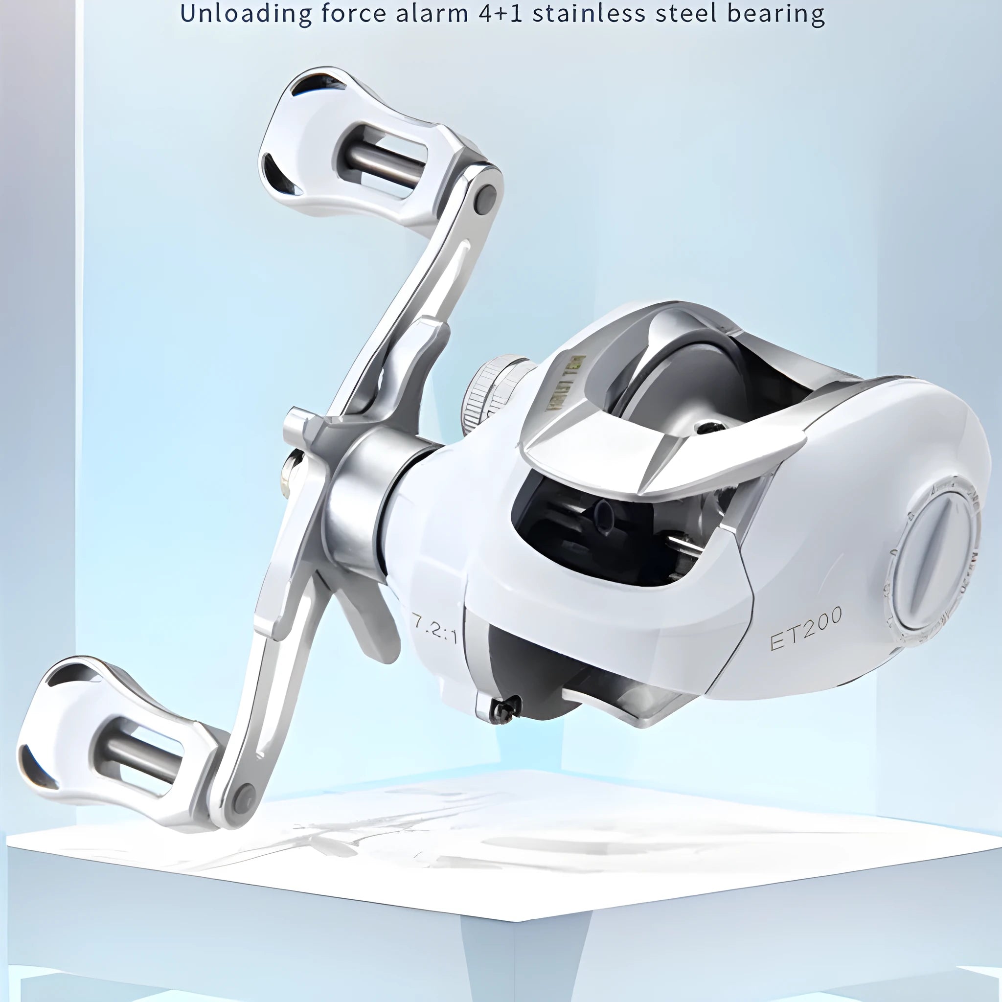 Small white ET Drop Wheel micro bait casting fishing reel on a neutral background.