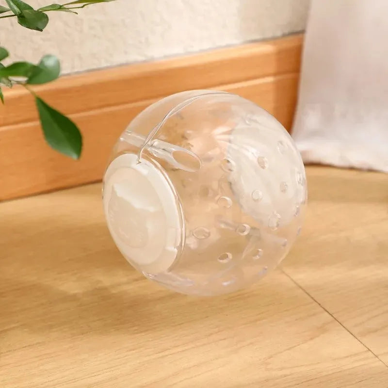 11.5cm blue ABS slow feeding ball for dogs and cats on a light background