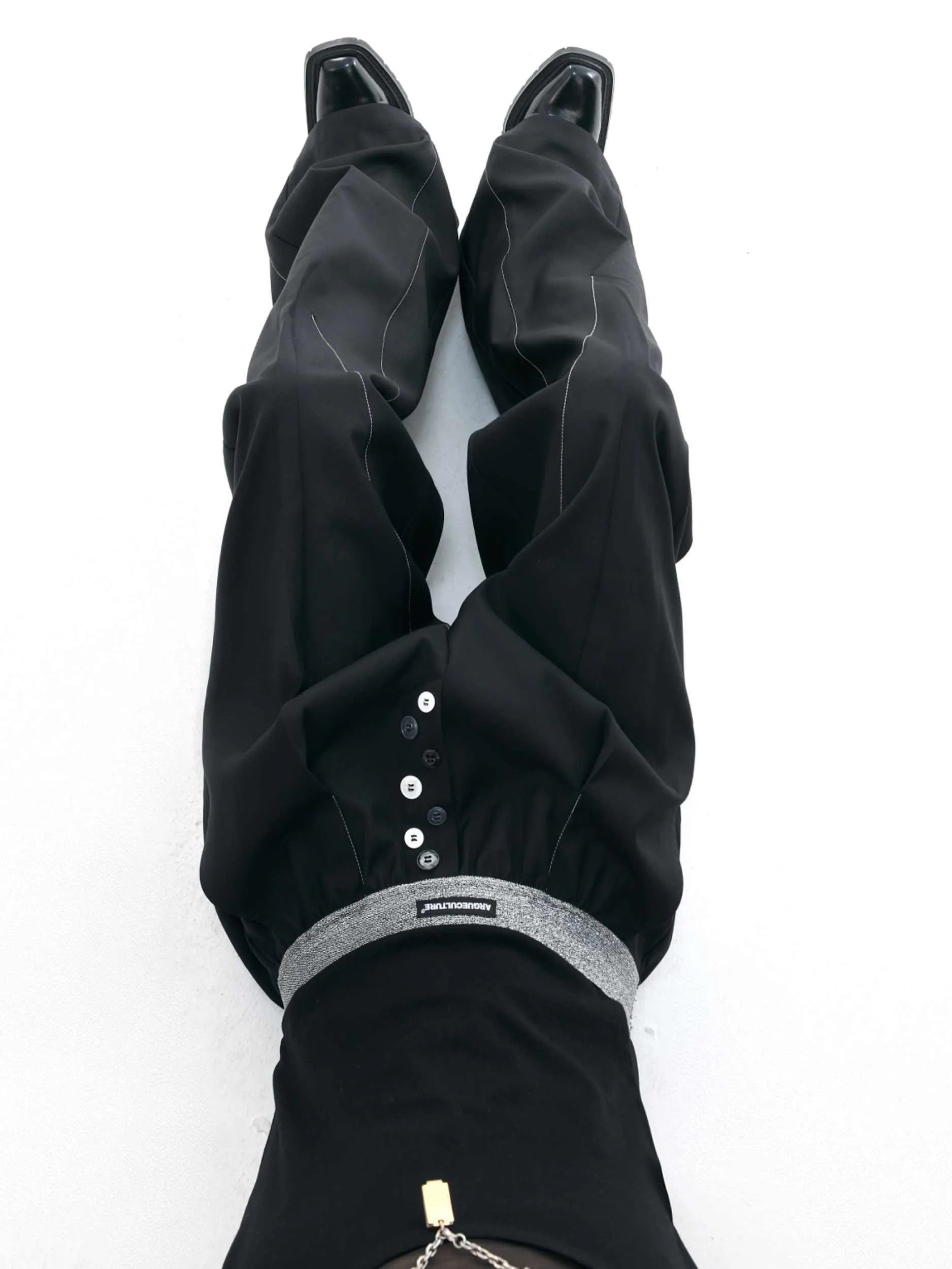 Straight-leg high-waist casual trousers with button-fly design in black or grey colour