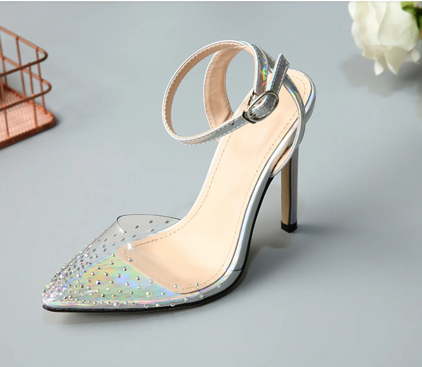 Women's pointed toe stiletto heel sandals with diamond decoration on the PVC upper.