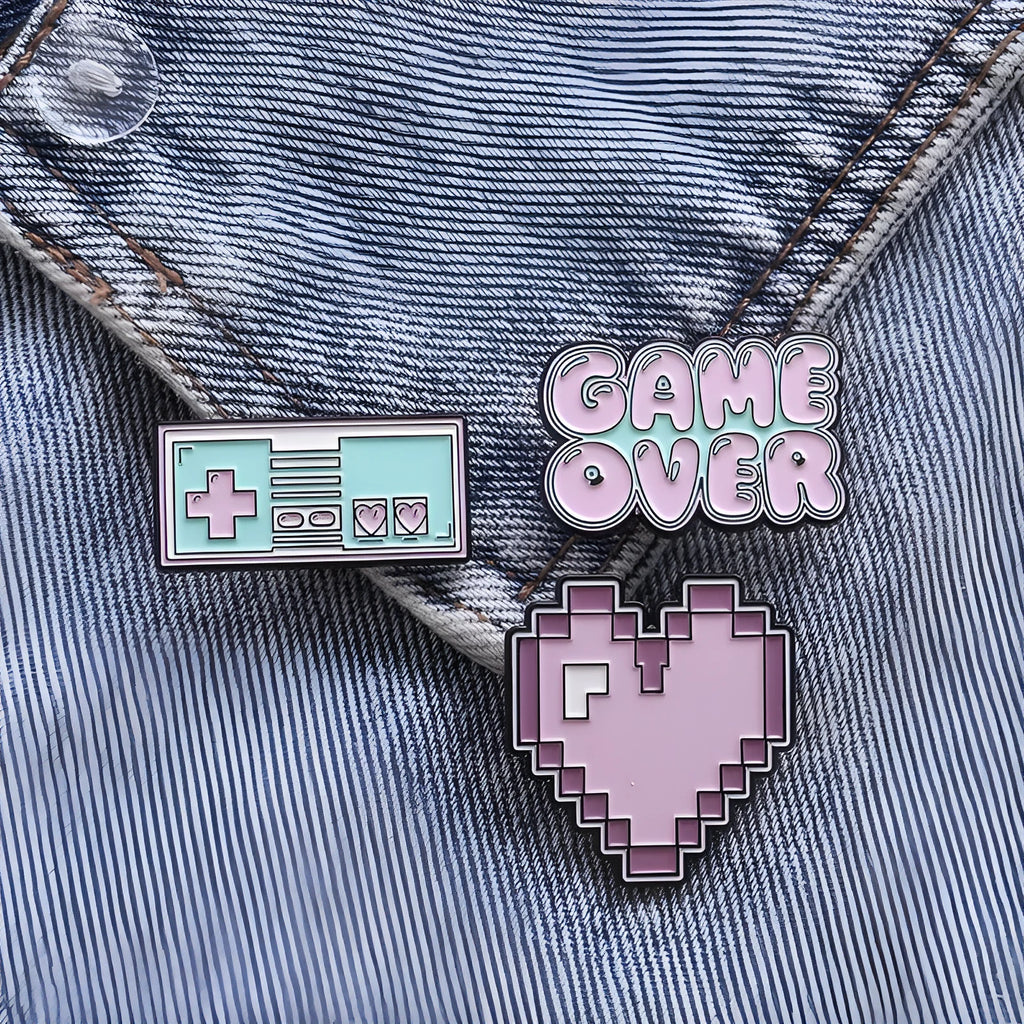 Stereo game console alloy pin badge in three colour options CC1122 CC1123 CC1124 on white background