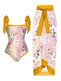 Women's printed two-piece swimsuit with a flowy chiffon skirt in a floral pattern design.