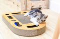 Brown corrugated cat scratch board with attached ball measuring 50.5x30.5x6cm