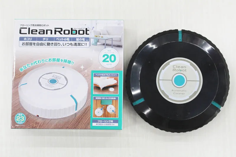 AC household automatic sweeping robot in black on a wooden floor.