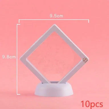 Transparent 3D floating display case holding a coin, with black and white size options