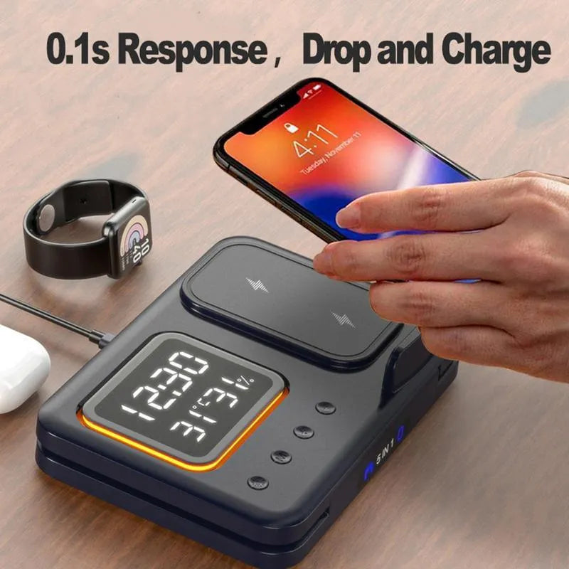 Black 5-in-1 wireless charging dock station showing phone, watch, and earbuds charging next to LED digital clock display.
