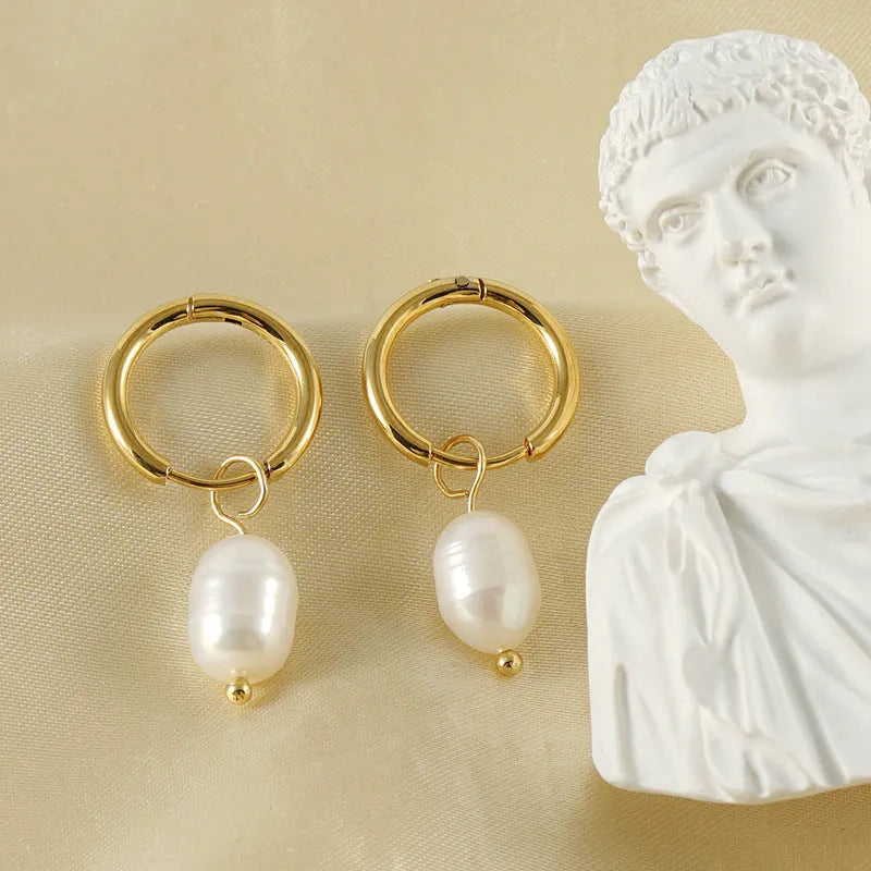 Gold geometric women's earrings with a central pearl, made from stainless steel and titanium steel.