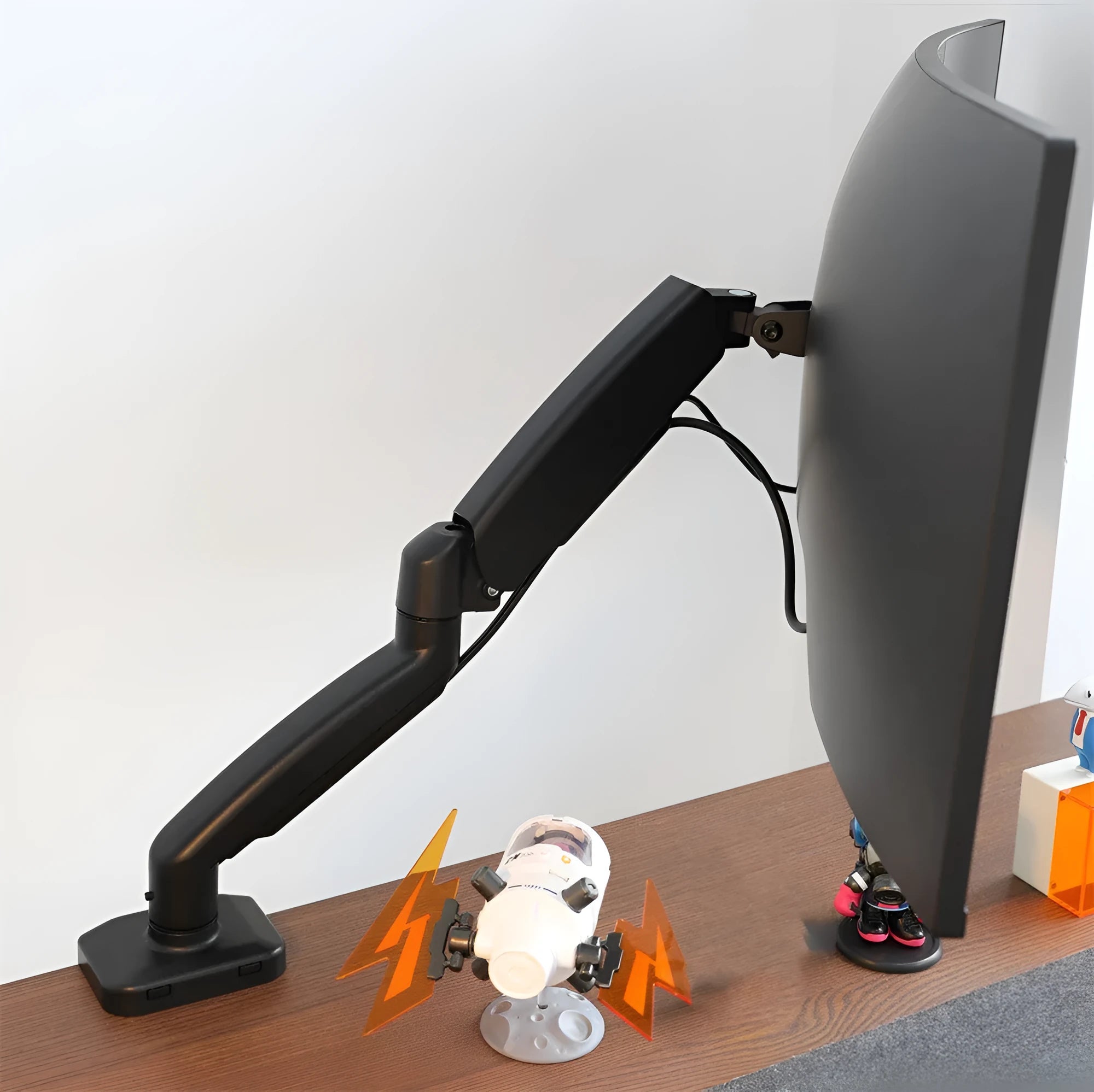 Black rotating telescopic LCD screen bracket elevated on table with monitor