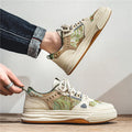 Beige and Milan green canvas casual shoes with flat heel and round toe on a plain background.