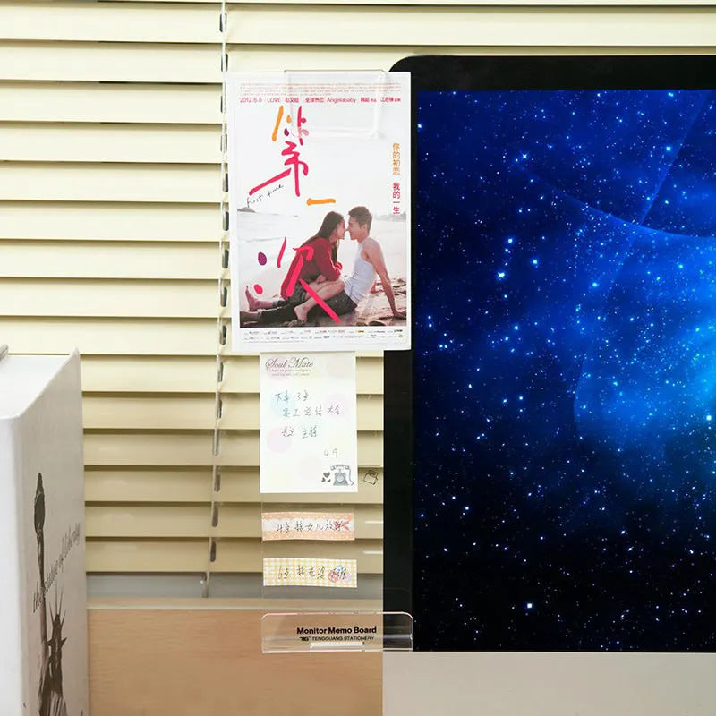 Clear acrylic memo board attached to a monitor with a post-it note on the surface