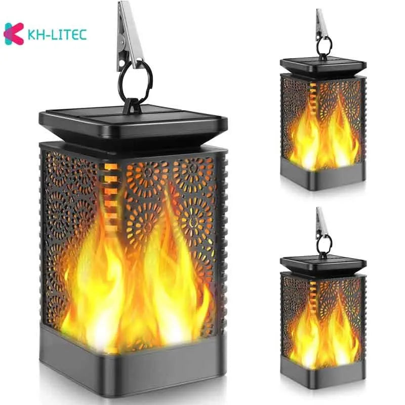 Set of four black solar-powered garden lanterns with flickering flame LED effect